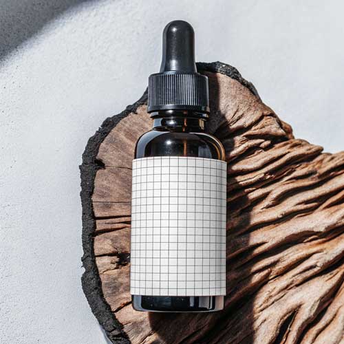 Amber glass dropper bottle cosmetic mockup PSD